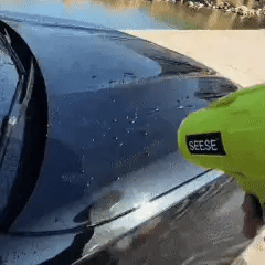 Zooxic Pro Air™ blowing water off a car bonnet in the driveway